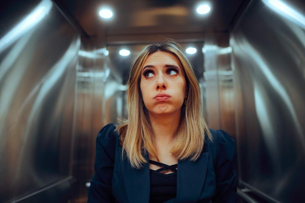 Blond woman with fear of elevators