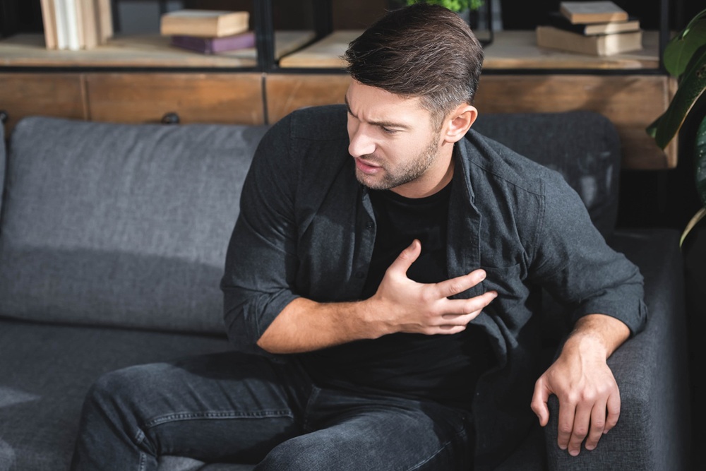 man with OCD having a panic attack