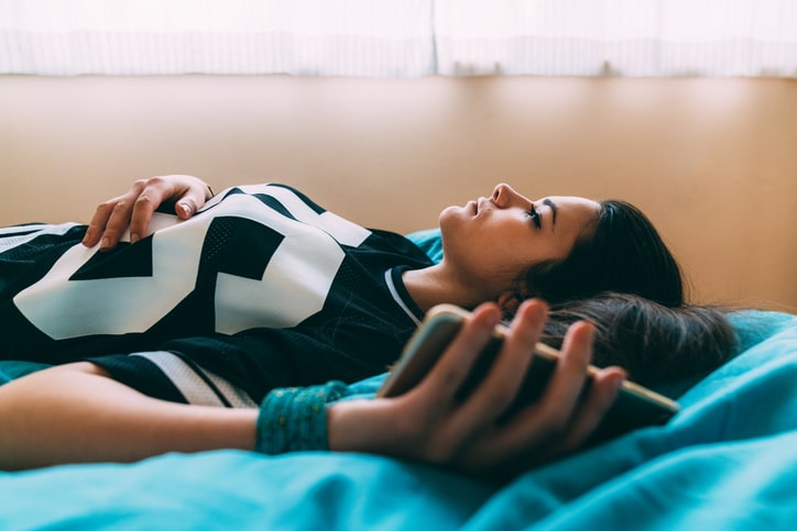 Woman with Pure o ocd ruminating on her bed